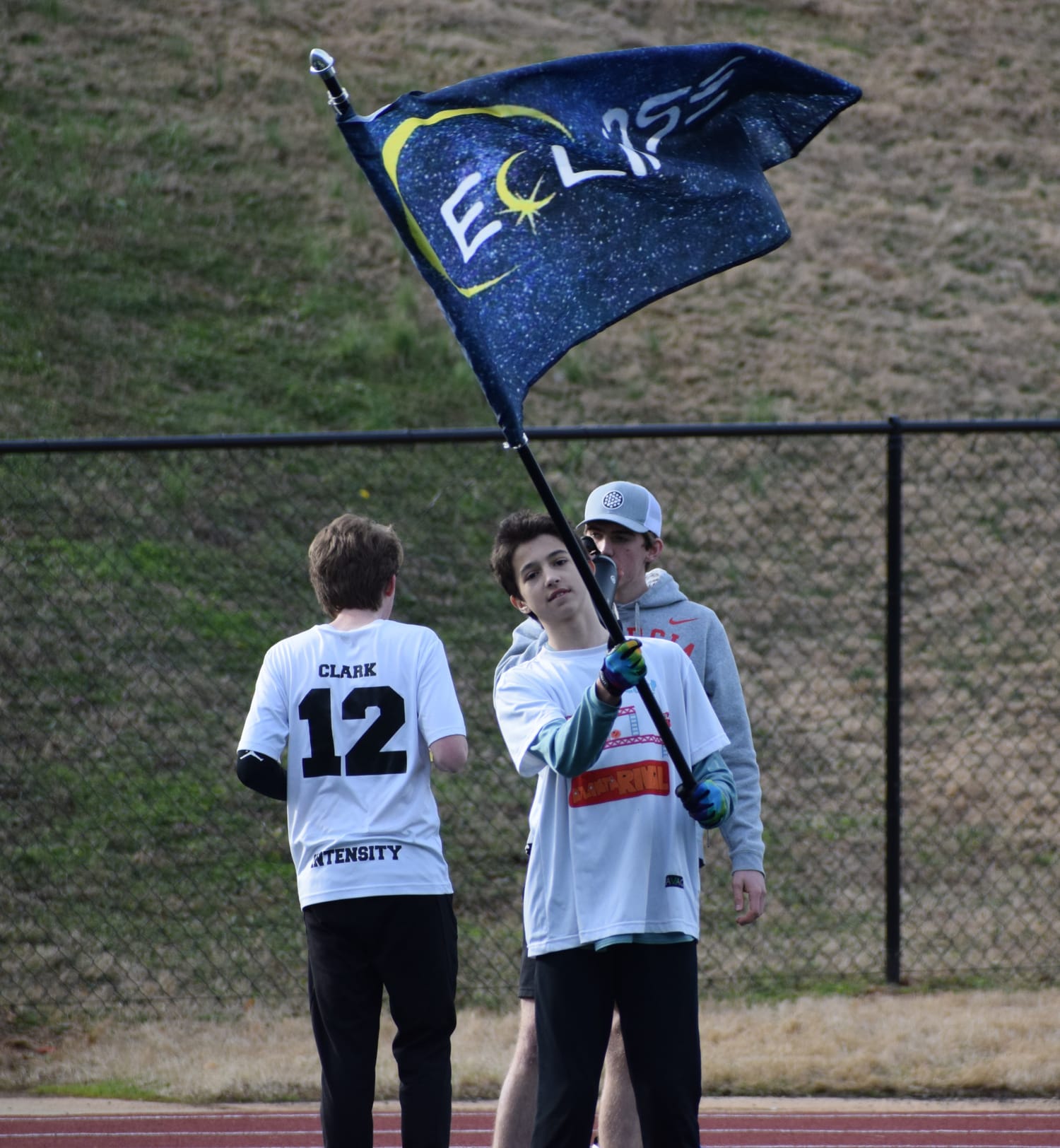 An Eclipse player waving the team flag on the sideline